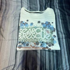Enyce White Tee with Blue and Black Snowflake Design